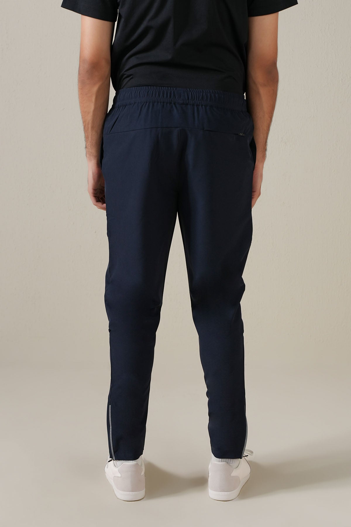 MEN REFLECT TAPERED TRACK PANTS